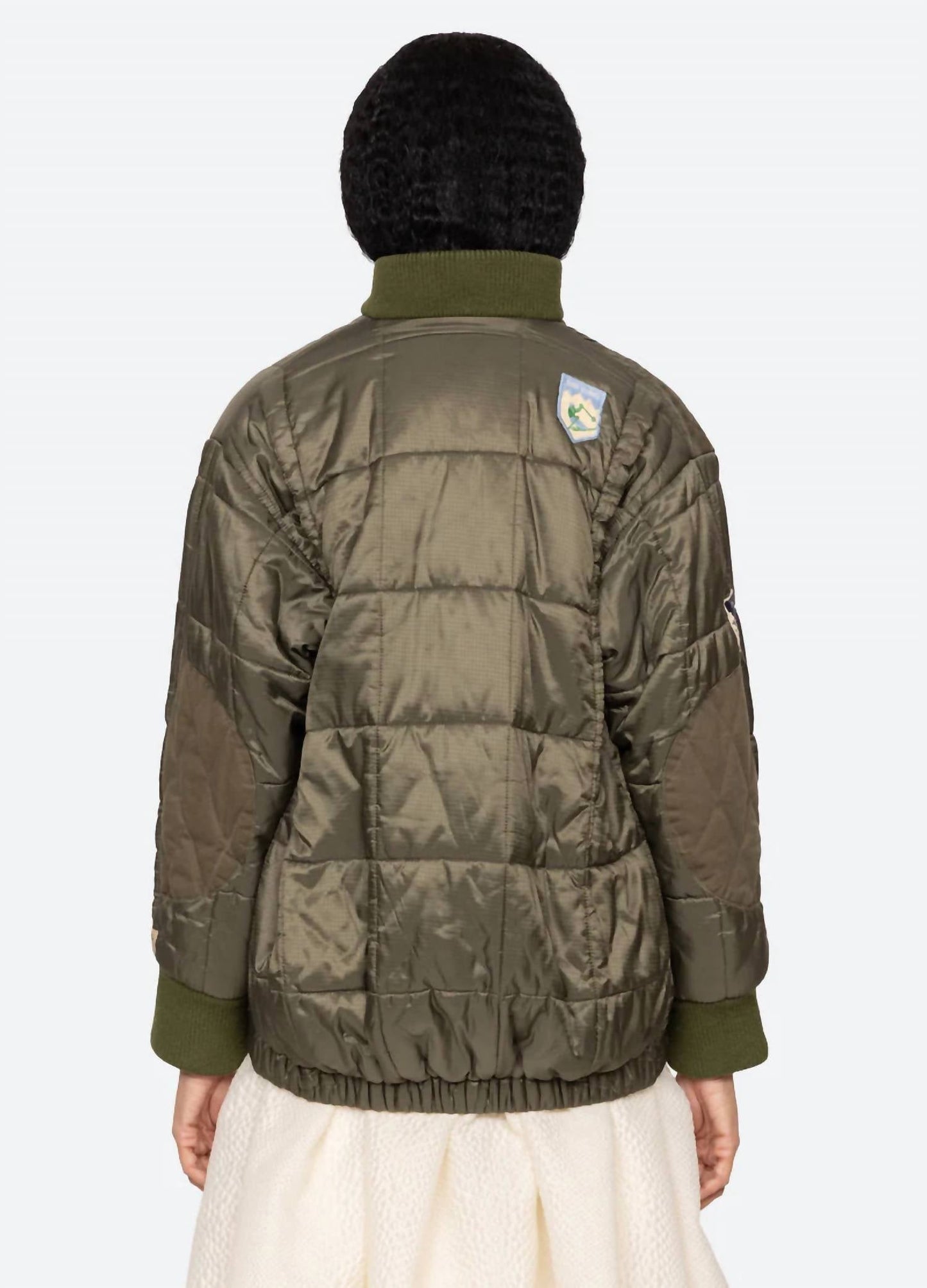 Eira Quilted Patched Puffer Jacket In Sea