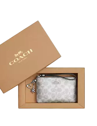 Coach Boxed Corner Zip Wristlet In Signature Canvas With Charms