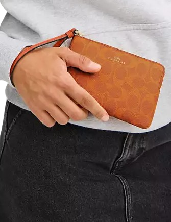 Coach Corner Zip Wristlet In Signature Canvas