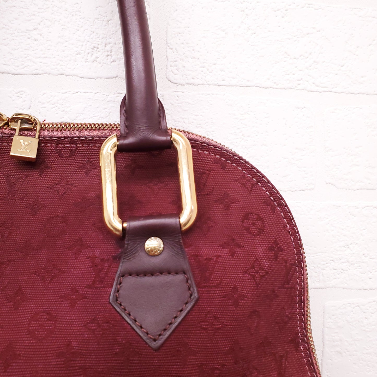LOUIS VUITTON VINTAGE BURGUNDY MONOGRAM 'ALMA' BAG